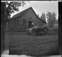 Harry Schmitz and Wilfrid Cline, Jr. visiting Whitmore's store in Whitmore, Shasta County, 1917