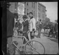 Guy M. West stands in his racing suit, Los Angeles, about 1900