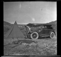 H. H. West's Cadillac and a tent at Arch Beach campsite, Laguna Beach, about 1921