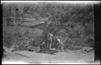 Men working at the base of the cable draw works near Weeping Spring in Zion National Park, 1923