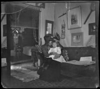 Annie M. Brain and Aileen Brain sitting on a sofa, Santa Monica, [about 1900]