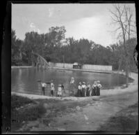 Group stands in front of Lewis Lake, Elliott vicinity, 1900