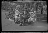 Josephine and Will Witherby seated on a bench with Mertie West at Disneyland, Anaheim, 1957