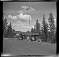 Cars passing through the west entrance of Yellowstone, Yellowstone National Park, 1942