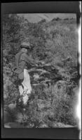 H. H. West fishing in Pine Creek, Inyo County vicinity, about 1930