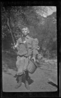 H. H. West, Jr. poses with his fishing gear at Matilija Creek, Ojai vicinity, about 1925