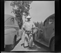 Agnes Whitaker poses with a string of blue gills and crappies, Big Bear Lake, 1944