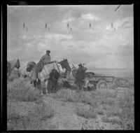 Chet Edgell standing near his truck and Leslie L. McAfee sitting on horseback, Independence vicinity, 1916