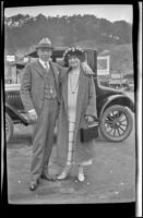 H. H. West and Mertie West pose with their arms around each other in front of a car, San Francisco, 1924