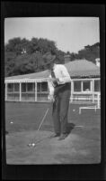 A man gets ready to tee off at the golf course, Monterey vicinity, about 1920