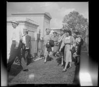 Mertie West and others visit a cemetery, New Orleans, 1947