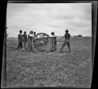 Servicemen loading and prepparing a cannon for firing during a Decoration Day commemoration at Los Angeles National Cemetery, Los Angeles, about 1895