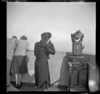 Mertie West stands on the observation deck atop the Empire State Building, New York, 1947