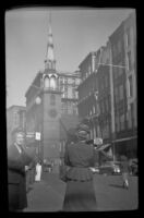 Mertie West and another woman stand down the street from the Old South Meeting House, Boston, 1947