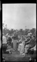 Ebe Shaw holds the tape at the end of the racing field, Ventura, 1948