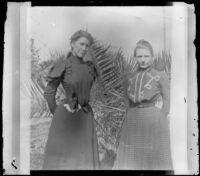 Agnes Ebey and Louise Ambrose pose outside the Ambrose home, Los Angeles, about 1894