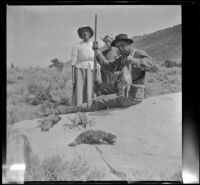 Minnie West, Elizabeth West and H. H. West pose with the limit of sage hen, Mammoth Lakes vicinity, 1915