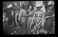 Four women pose at the Iowa Picnic in Bixby Park, Long Beach, 1938