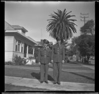 Gilbert Cecil West and William Roscoe Wright stand in uniform on H. H. West's front walk, Los Angeles, 1941