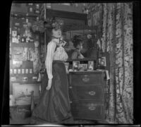 Ellen Lorene (Pinkie) Lemberger poses in H. H. West's bedroom, Los Angeles, 1901