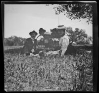 Charlie Rucher, Nella West and Louise Ambrose dine in the grass at Devils Gate, Pasadena, 1899