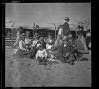 Abraham, Mary, and Mertie Whitaker sit in the sand with William and Josie Shaw, as well as Lelia Gillan and Agnes Hawley, Santa Monica, 1901