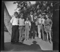 A group of boys, including H. H. West, Jr., pose for a photograph after taking tests for the Boy Scouts, Los Angeles, 1931