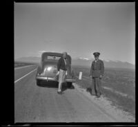 Mertie West and Staff Sergeant John H. Frame of Camden stand on the roadside, Wells vicinity, 1942