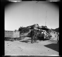 A horse pushes a trolley along the tracks of the Mt. Lowe Scenic Railway mule train, Los Angeles County, 1932