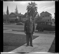 Gilbert Cecil West poses in uniform on H. H. West's front walk, Los Angeles, 1941