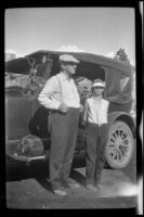 H. H. West Jr. and William Shaw stand next to H. H. West's car en route to Twin Lakes from Los Angeles, 1929