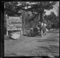 H. H. West's family and friends in a car on a dirt road, Mount Baldy vicinity, about 1914