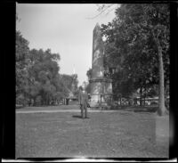 H. H. West poses near the Boston Massacre/Crispus Attucks Memorial in Boston Common, Boston, 1947