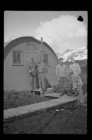 H. H. West, Jr. and 3 unidentified servicemen pose in front of their quarters, Dutch Harbor, 1943