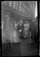 Mertie West strolls through a public market, Boston, 1947