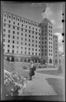 Mertie West poses in front of Chateau Lake Louise, Lake Louise, 1947