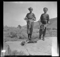 Elizabeth and Frances West hold sage hen and pose for a photograph, Mammoth Lakes Vicinity, 1915