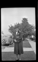 Mertie West poses outside the West's residence on North Ridgewood Place, Los Angeles, 1945