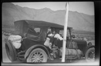 H. H. West Jr. and William Shaw sit in H. H. West's car en route to Twin Lakes from Los Angeles, 1929