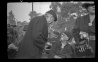 Mrs. Stover sits on a bench at the Iowa Picnic at Lincoln park, Los Angeles, 1940