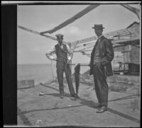 George Thomas of Pomona and George Crackel display a caught fish, Santa Catalina Island, 1909