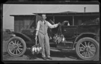 H. H. West poses with the limit of teal from a duck shoot, Orange County vicinity, 1909