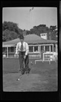 Jim Scullin gets ready to tee off at the golf course, Monterey vicinity, about 1920