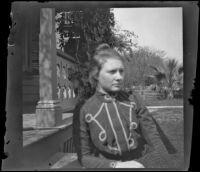 Louise Ambrose poses while sitting on the front steps of the Ambrose home, Los Angeles, about 1894