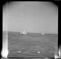 Two sailboats leaving the harbor in San Pedro, Los Angeles, about 1910