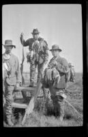 Keeper E. D. Hardy, Frank Mellus and John A. Hunter pose with ducks, Seal Beach vicinity, 1916