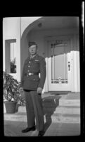 P.F.C. H. H. West, Jr. poses in front of the West's residence while visiting on a 3-day pass, Los Angeles, 1944