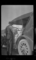 Harry Schmitz standing by the side of the car, Red Bluff, 1917