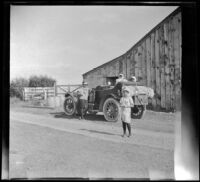 Mary A. West, Minnie West, Elizabeth West and Frances West pose for a photograph while stopped in front of a barn, Mammoth Lakes vicinity, about 1915