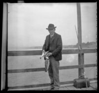 H. H. West holds fish he caught, Venice, about 1903